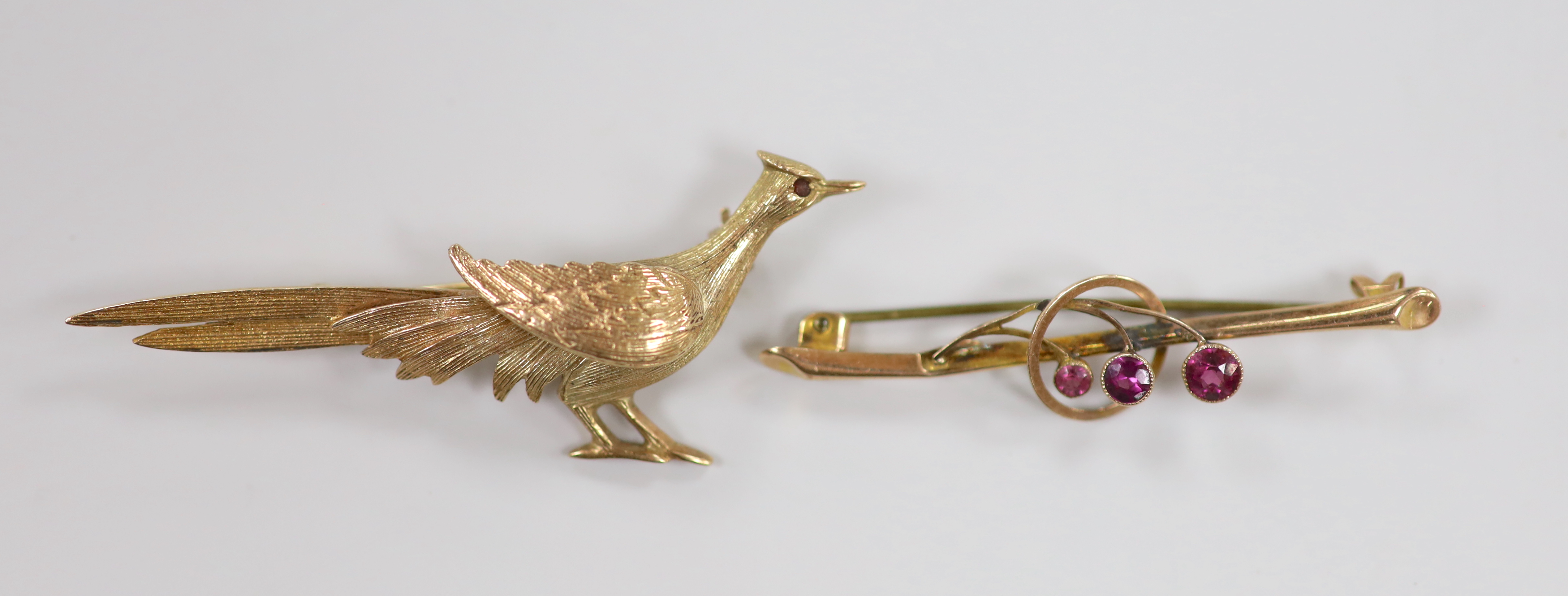 A 1960's 9ct gold pheasant brooch, 60mm and an earlier 9ct and gem set bar brooch, gross weight 7.3 grams.